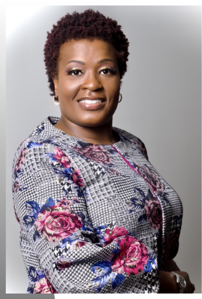 A woman with short hair wearing floral print.